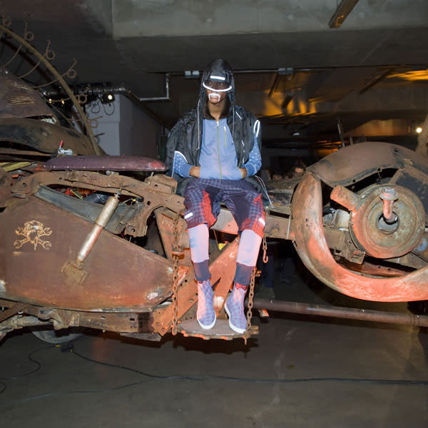 <b>Model, Vivienne Westwood</b><br><br>The Vivienne Westwood AW13 presentation saw models decked out in bomber jackets and sports shoes seated on old vehicles.