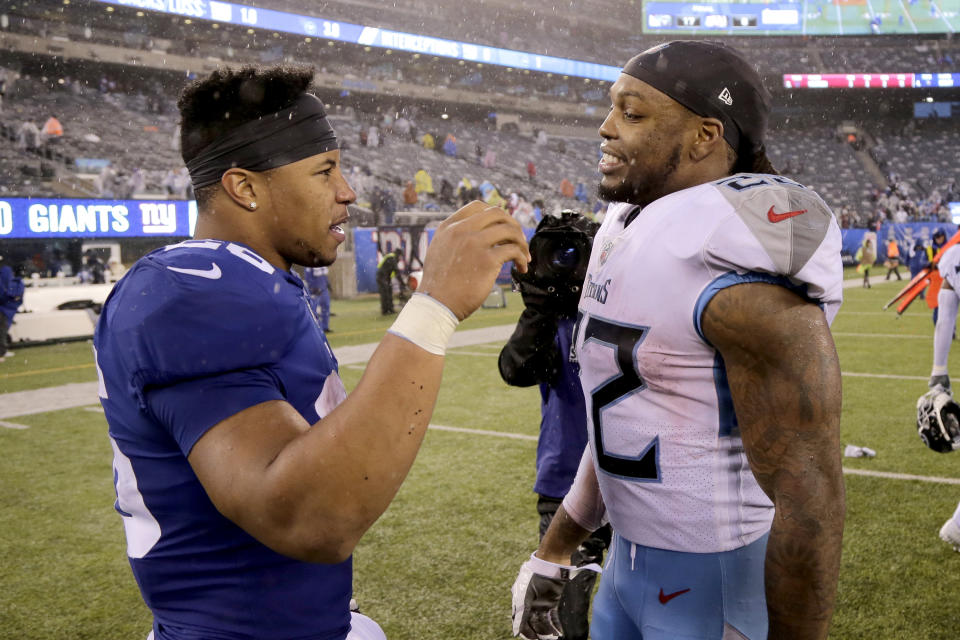 Derrick Henry has Saquon Barkley's back.  (AP Photo/Seth Wenik)