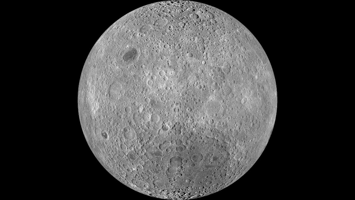  The grey, cratered surface of the moon. 