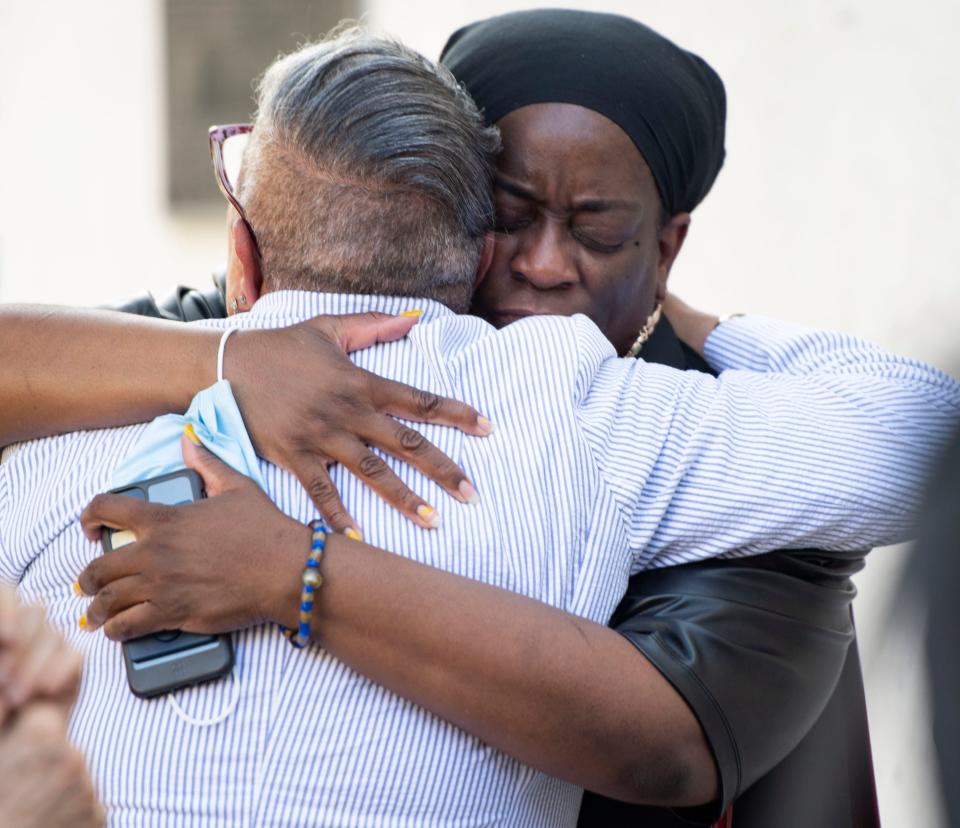 Antonia Coleman of Chicago, I.L., embraces Rev. Sharon Risher outside of Emanuel AME Church before attending the National Bible Study Commemorating 7 Years After the Mother Emanuel Massacre in Charleston, Friday, June 17, 2022. 