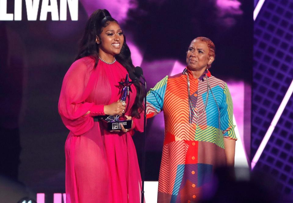 Jazmine Sullivan accepts the Album of the Year award with Pam Sullivan onstage at the BET Awards 2021 at Microsoft Theater on June 27, 2021