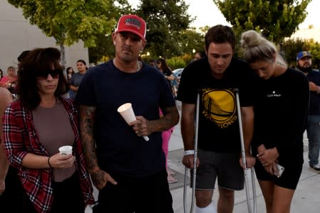 Survivors of the Gilroy Garlic Festival mass shooting, Shannon Gilbert, Brendon Gorshe, Nick McFarland and Sarah Ordaz, attend a vigil outside of Gilroy City Hall