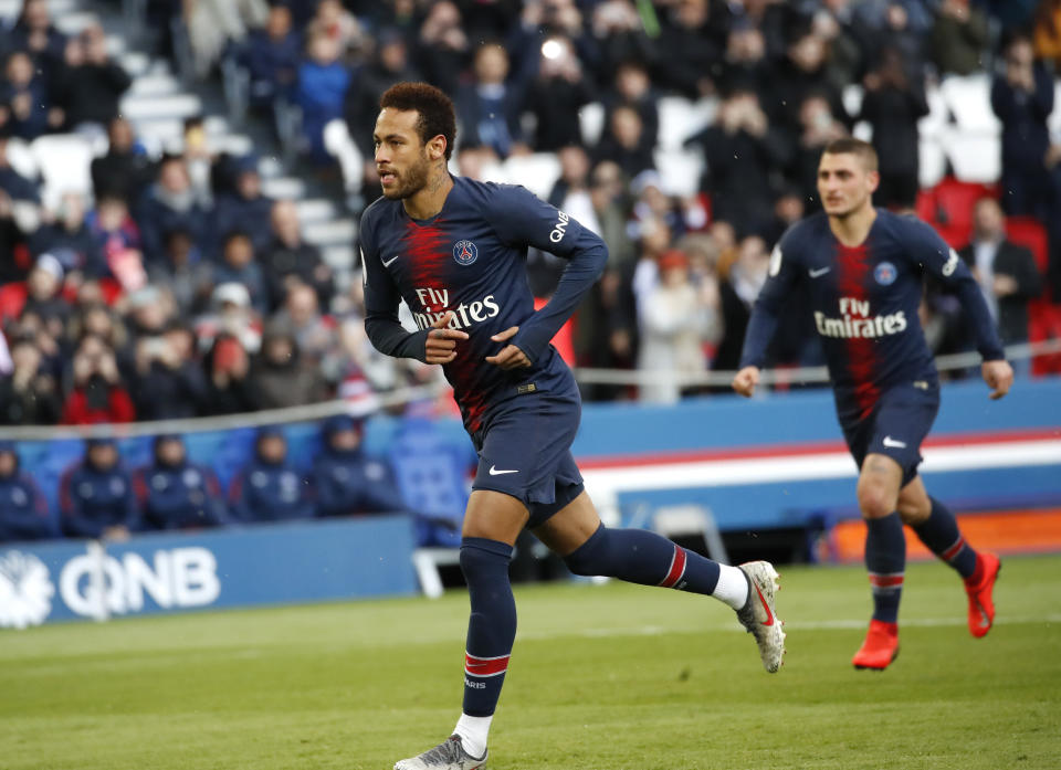 PSG's Neymar celebrates after scoring the opening goal during the French League One soccer match between Paris Saint-Germain and Nice at the Parc des Princes stadium in Paris, France, Saturday, May 4, 2019. (AP Photo/Christophe Ena)