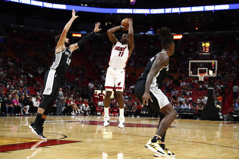 Miami Heat guard Dion Waiters (11) shoots the ball against San Antonio Spurs guard Marco Belinelli (18) during the second half of an NBA preseason basketball game on Tuesday, Oct. 8, 2019, in Miami. (AP Photo/Brynn Anderson)