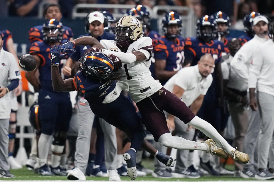 Texas State cornerback Joshua Eaton (1) breaks up a pass intended for UTSA wide receiver Joshua Cephus (2) during the second half of an NCAA college football game, Saturday, Sept. 9, 2023, in San Antonio. (AP Photo/Eric Gay)