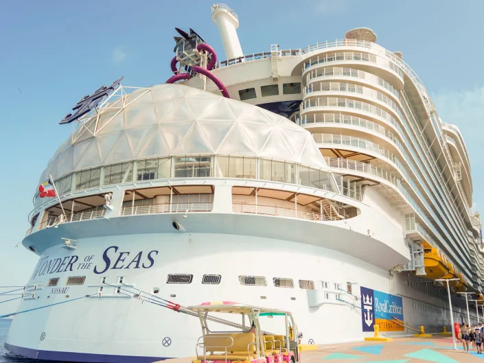 the back of wonder of the seas cruise ship docked in the Bahamas with blue skies