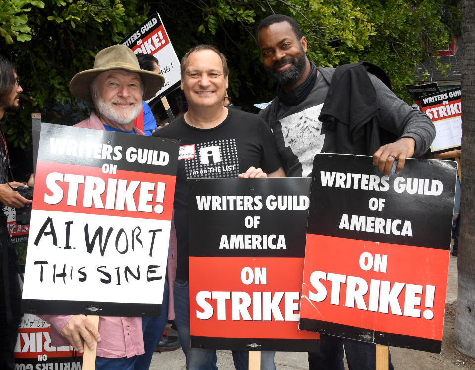 AI BURBANK, CALIFORNIA - MAY 24: Steven L. Sears, Jeff Gund and Damion Poitier participate in the 2023 Writers Guild Of America Strike: Superhero Day held in front of  Warner Bros. Studios on May 24, 2023 in Burbank, California. (Photo by Albert L. Ortega/Getty Images)