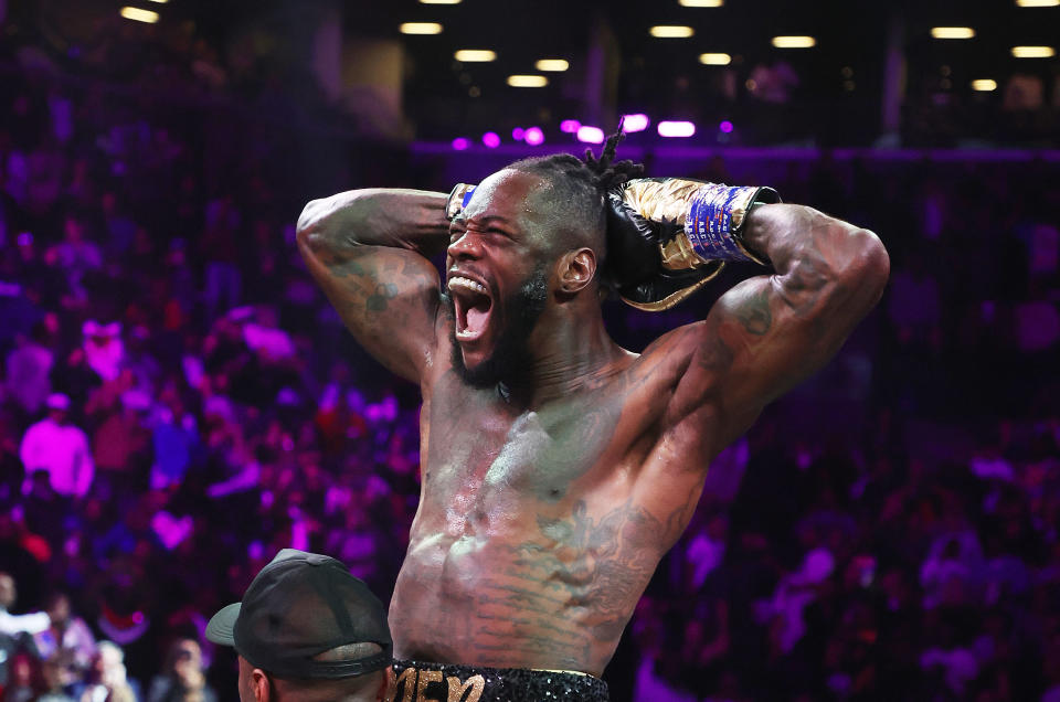 BROOKLYN, NEW YORK - OCTOBER 15:  Deontay Wilder celebrates after knocking out Robert Helenius in the first round during their WBC world heavyweight title eliminator bout at Barclays Center on October 15, 2022 in Brooklyn, New York. (Photo by Al Bello/Getty Images)