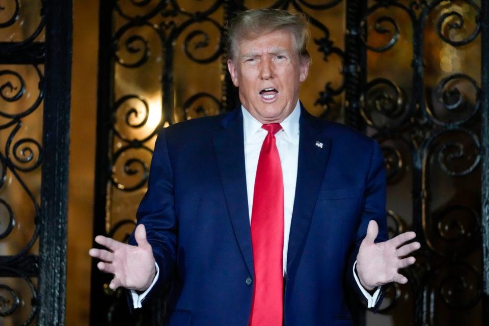 Donald Trump speaks to reporters outside Mar-a-Lago’s gates on 16 February. (AP)