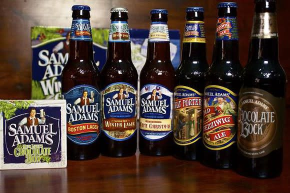 Six bottles lined up in a row from Boston Beer's Sam Adams lineup.