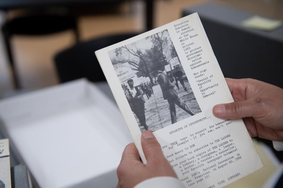 Columnist Erika D. Smith holds a pamphlet showing Ernestine Eckstein at a Washington, D.C., march in 1965.