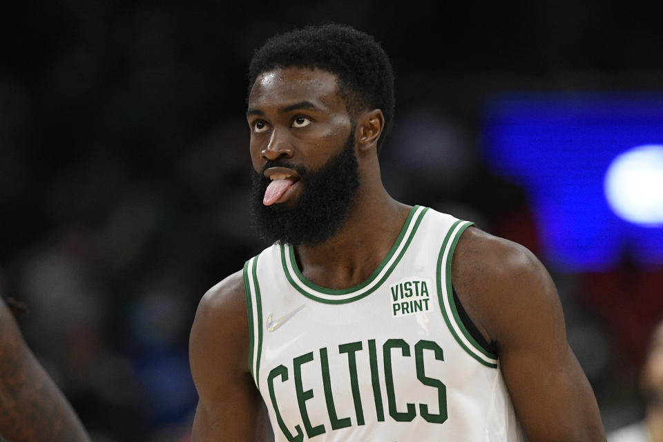 Boston Celtics guard Jaylen Brown (7) reacts during second half of an NBA basketball game against the Washington Wizards, Saturday, Oct. 30, 2021, in Washington. The Wizards won 115-112 in double overtime. (AP Photo/Nick Wass)