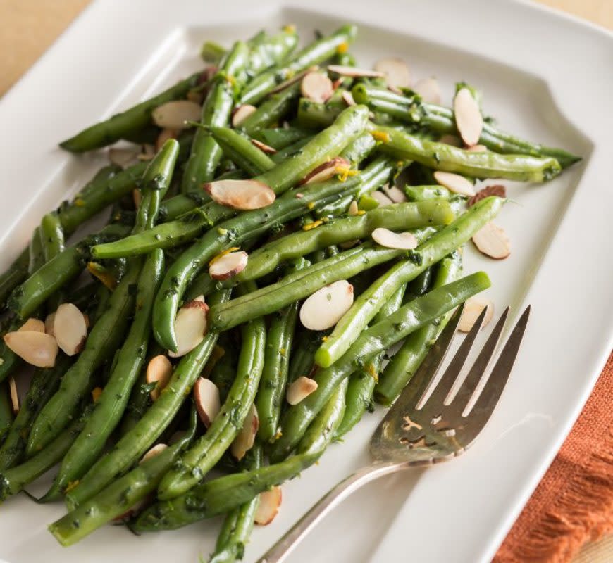 <p>Courtesy of Claire Gallam</p><p>A nutty take on a simple green bean side.</p><p><strong>Get the Recipe: <a href="/841289/clairegallam/blue-cheese-walnut-roasted-green-beans/" data-ylk="slk:Orange Almond Green Beans;elm:context_link;itc:0;sec:content-canvas" class="link rapid-noclick-resp">Orange Almond Green Beans</a></strong></p>