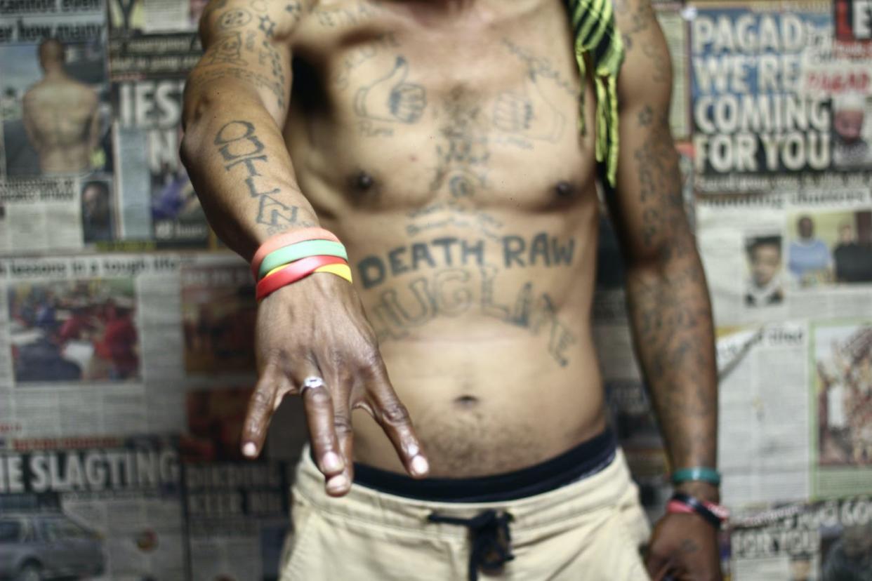 A former gang member in Cape Town, South Africa, shows off his tattoos. Courtesy Dariusz Dziewanski