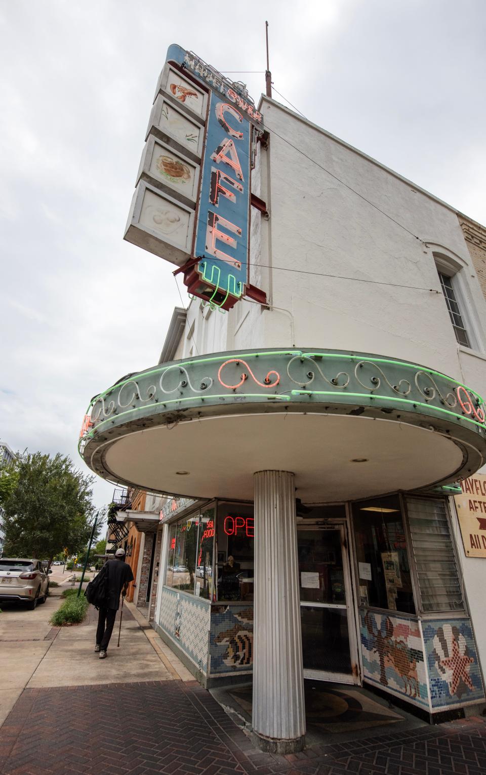 A man strolls by the Mayflower in Jackson on Sept. 14, 2023. The Mayflower, opened in 1935, is one of the oldest restaurants in Jackson.