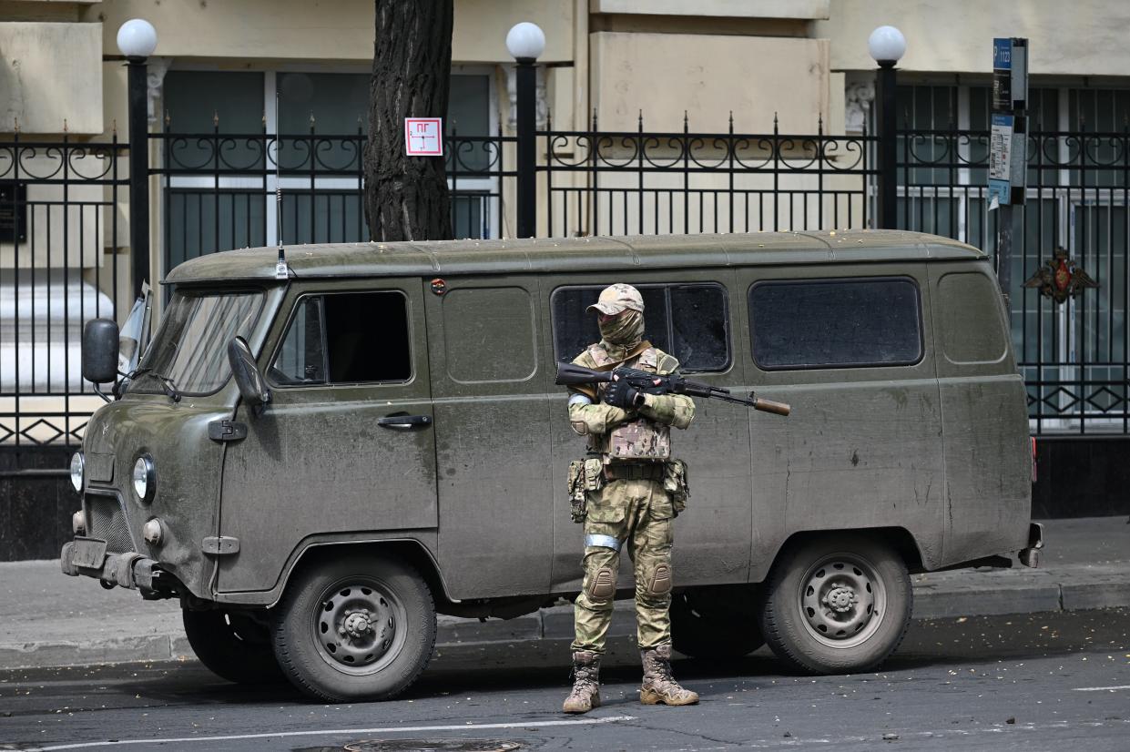 Wagner fighter stands guard in a street near the headquarters of the Southern Military District in the city of Rostov-on-Don (REUTERS)