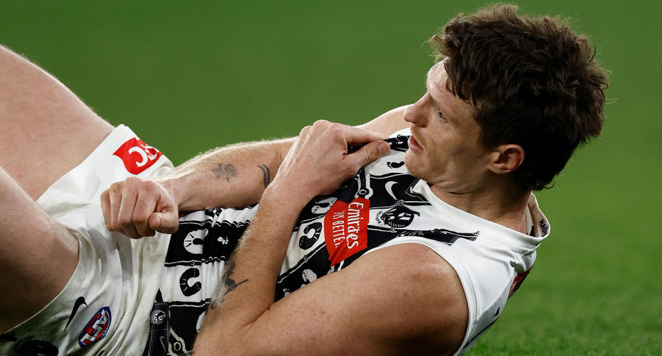 Seen here, Collingwood star Brody Mihocek after suffering a pectoral injury.