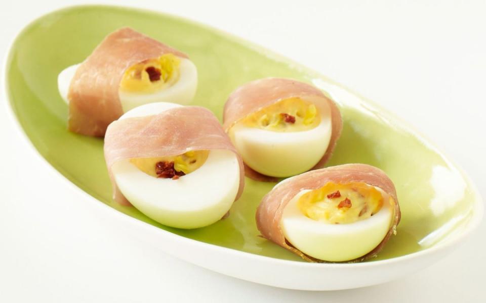 <p>Tina Rupp</p><p>Deviled eggs go Italian, with spicy peperoncini, sun-dried tomatoes and a prosciutto wrap.</p><p><strong>Get the recipe: <a href="https://parade.com/19402/dash/prosciutto-wrapped-deviled-eggs/" rel="nofollow noopener" target="_blank" data-ylk="slk:Prosciutto-Wrapped Deviled Eggs;elm:context_link;itc:0;sec:content-canvas" class="link ">Prosciutto-Wrapped Deviled Eggs</a></strong></p><p><strong>Related: <a href="https://parade.com/1024610/kristamarshall/best-omelet-recipes/" rel="nofollow noopener" target="_blank" data-ylk="slk:25 Best Omelet Recipes;elm:context_link;itc:0;sec:content-canvas" class="link ">25 Best Omelet Recipes</a></strong></p>