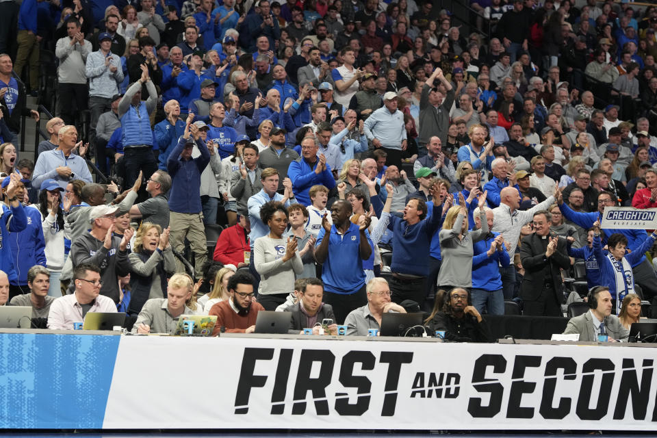 Creighton fans applaud as time runs out in the team's second-round college basketball game against Baylor in the men's NCAA Tournament on Sunday, March 19, 2023, in Denver. (AP Photo/David Zalubowski)