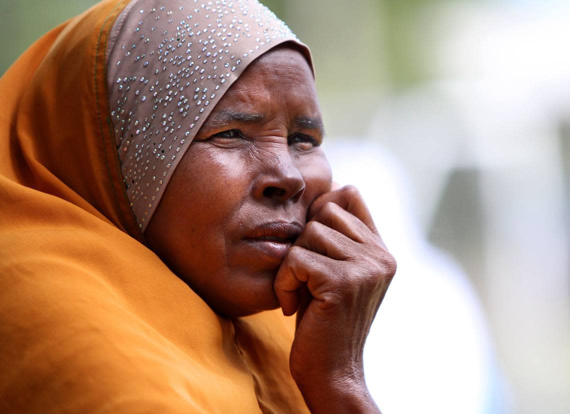 Asli Cismaail od Somalia watches her children, Najib, 12, and Anisa, 9, play soccer Saturday, Sept. 14, 2013, on the Duke University campus. The event, “Kicking It Together” was organized by Uniting NC and the refugee resettlement agency Church World Service.