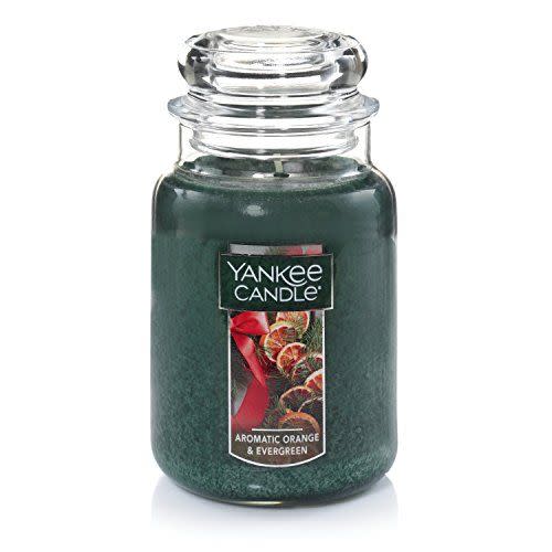 <p><strong>Yankee Candle</strong></p><p>amazon.com</p><p><a href="https://www.amazon.com/dp/B075TL1L2W?tag=syn-yahoo-20&ascsubtag=%5Bartid%7C10070.g.34371107%5Bsrc%7Cyahoo-us" rel="nofollow noopener" target="_blank" data-ylk="slk:Shop Now;elm:context_link;itc:0;sec:content-canvas" class="link ">Shop Now</a></p><p>Want to give the perfect seasonal or holiday-themed gift? This extra large candle from Yankee is a classic and would look great in a gift basket with anything from homemade cookies or cozy slippers.</p>