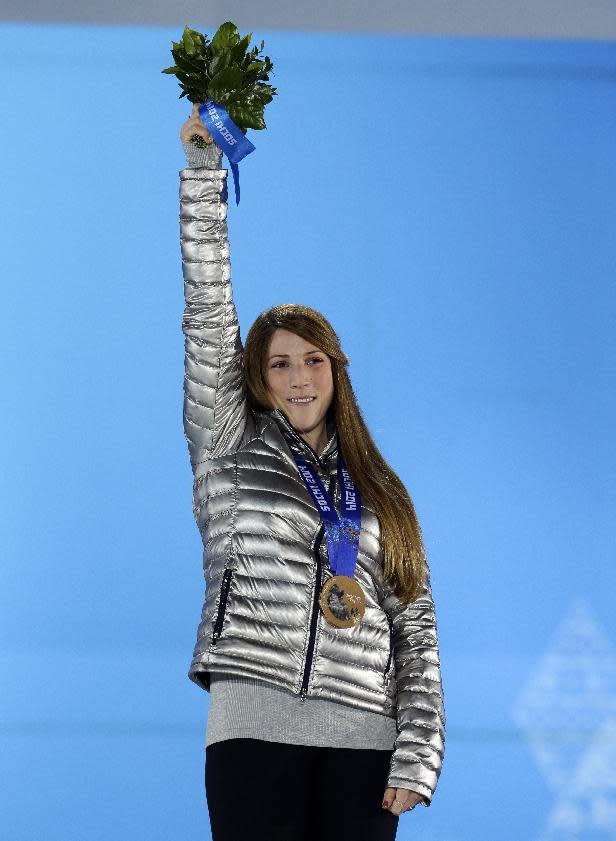 Women's luge singles bronze medalist Erin Hamlin of the United States stands on the podium during the medals ceremony at the 2014 Winter Olympics, Wednesday, Feb. 12, 2014, in Sochi, Russia. (AP Photo/Morry Gash)
