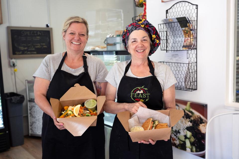 FEAST owner Michele Farmer (right) is offering her signature paninis, soups and salads, and has partnered with Debbie Richardson (left) of Morning Sunshine Eats to provide breakfast.