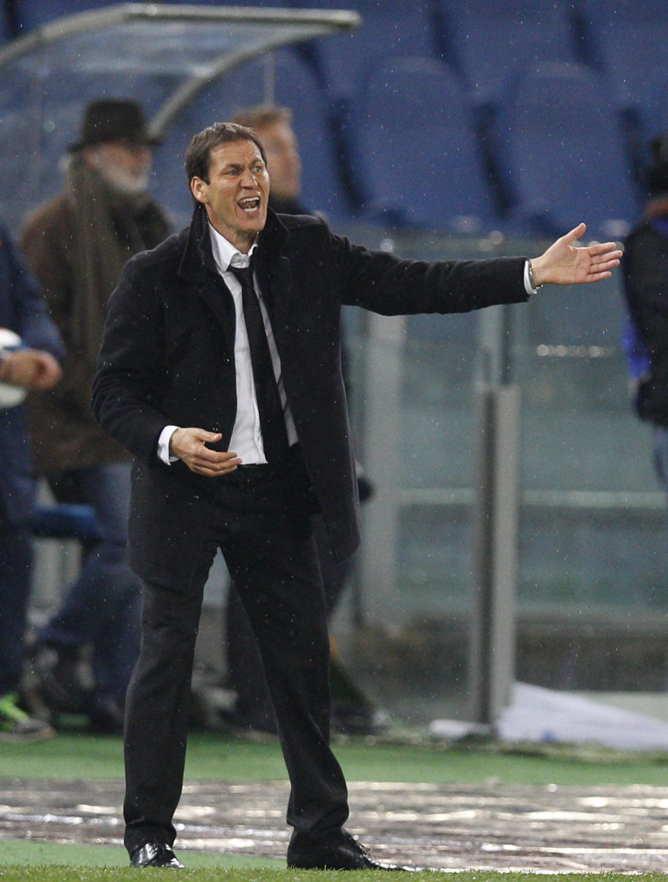 AS Roma coach Rudi Garcia calls out to his players during a Serie A soccer match between AS Roma and Torino, at Rome's Olympic Stadium, Tuesday, March 25, 2014. (AP Photo/Andrew Medichini)