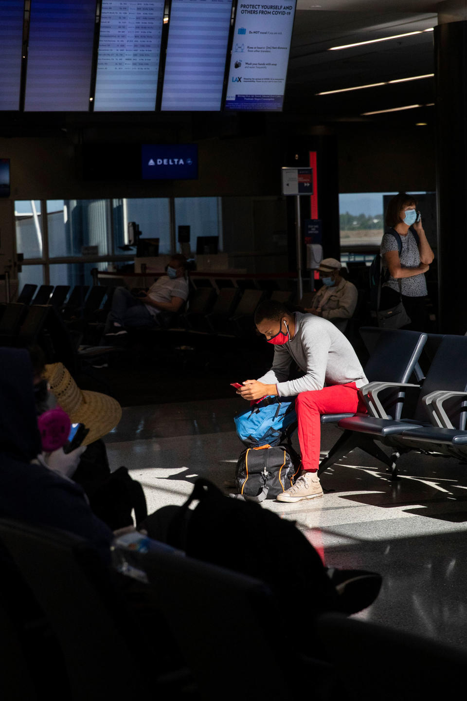 Travelers at Los Angeles International Airport on July 4<span class="copyright">Nancy Pastor—Polaris</span>