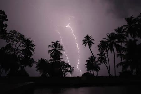 Lightning strikes over Lake Maracaibo in the village of Ologa, where the Catatumbo River feeds into the lake, in the western state of Zulia October 23, 2014. REUTERS/Jorge Silva