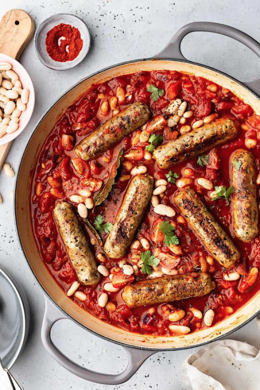 <p>Cupful of Kale</p><p>Hearty vegan sausage and cannellini bean stew in a rich and smoky tomato and red pepper sauce. This one pot dish is perfect for a comforting and no fuss weeknight dinner! Or lunch, or breakfast!</p><p><strong>Get the recipe: <a href="https://cupfulofkale.com/vegan-sausage-and-cannellini-bean-stew/" rel="nofollow noopener" target="_blank" data-ylk="slk:Vegan Sausage and Cannellini Bean Stew;elm:context_link;itc:0;sec:content-canvas" class="link rapid-noclick-resp"><em>Vegan Sausage and Cannellini Bean Stew</em></a></strong></p>