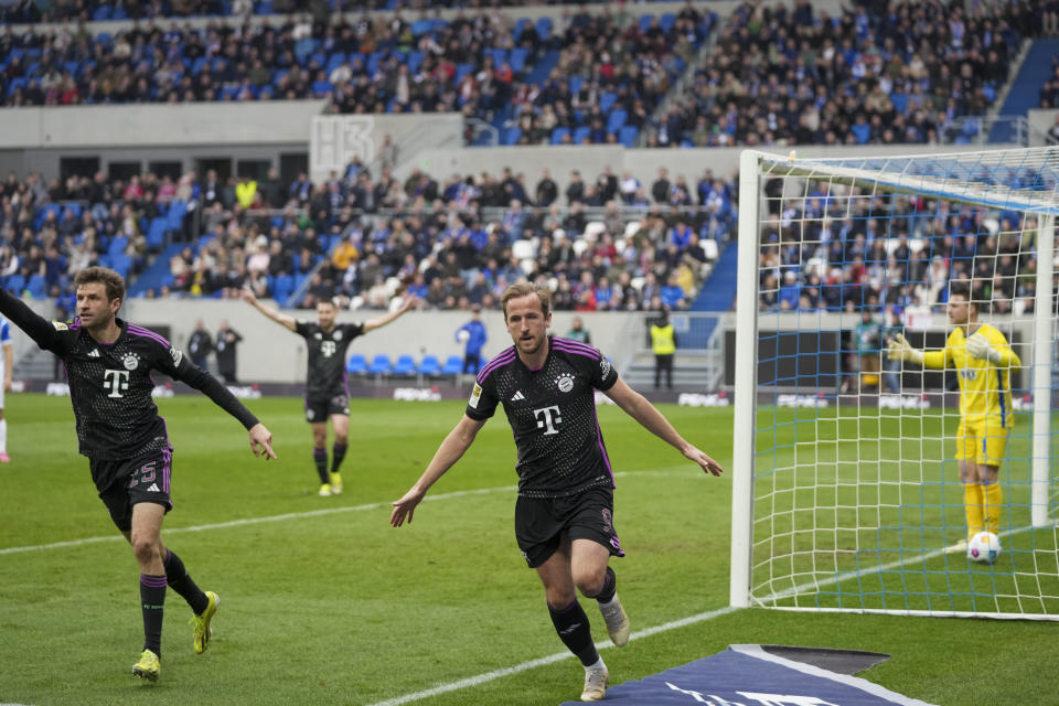 Bayern's Harry Kane celebrates after he scored his side's second goal during a German Bundesliga soccer match between SV Darmstadt 98 and Bayern Munich in Darmstadt, Germany, Saturday, March 16, 2024. (AP Photo/Michael Probst)