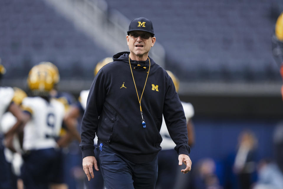 Michigan coach Jim Harbaugh watches the team's NCAA college football practice Saturday, Dec. 30, 2023, in Inglewood, Calif. Michigan is scheduled to play against Alabama on New Year's Day in the Rose Bowl, a semifinal in the College Football Playoff. (AP Photo/Ryan Sun)