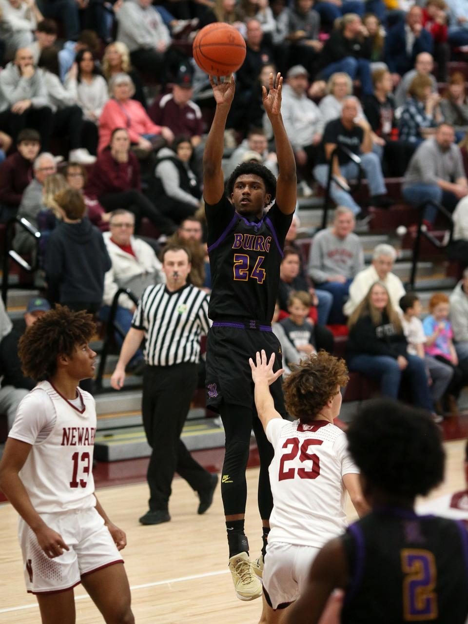 Reynoldsburg's Jordan Fisher takes a shot during a 45-41 loss at Newark on Dec. 22.