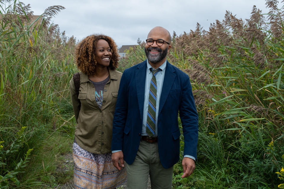 two people walking in a field