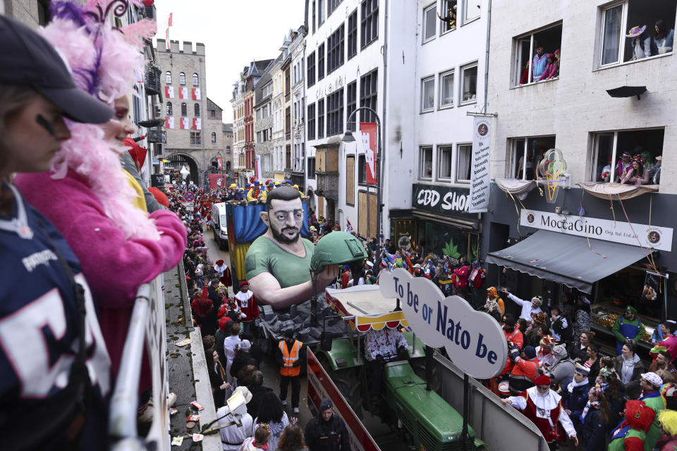 A float depicting Ukrainian President Volodymyr Zelenskyy is driven through the streets during the Rose Monday parade in Cologne, Germany, Monday, Feb. 12, 2024. (Rolf Vennenbernd/dpa via AP)