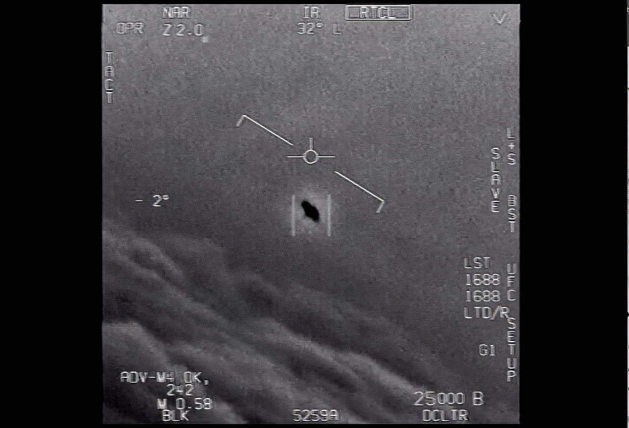 The image from video provided by the Department of Defense labelled Gimbal, from 2015, an unexplained object is seen at center as it is tracked as it soars high along the clouds, traveling against the wind. “There's a whole fleet of them,” one naval aviator tells another, though only one indistinct object is shown. “It's rotating." The U.S. government has been taking a hard look at unidentified flying objects, under orders from Congress, and a report summarizing what officials know is expected to come out in June 2021. (Department of Defense via AP)