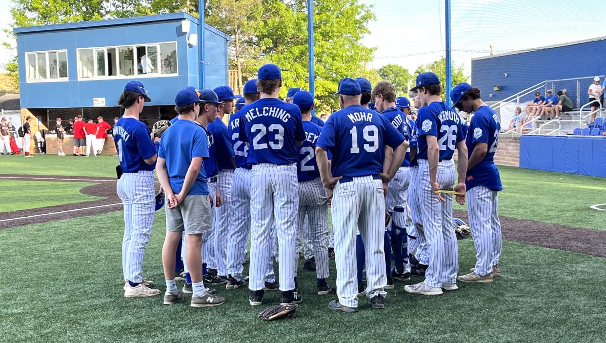 Covington Catholic coaches and players meet after the Colonels defeated Holy Cross 6-0 on Thursday night at CovCath. The Colonels improved to 22-2.
