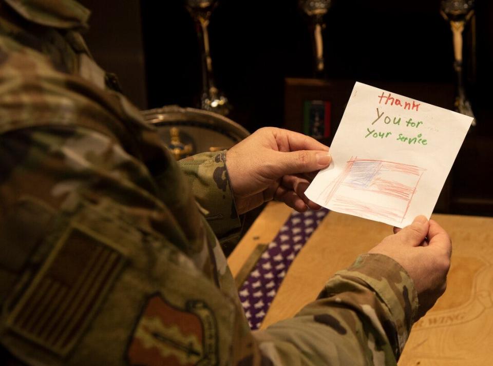 Senior Master Sgt. Jeremy Holcomb, 33rd Fighter Wing, reads a letter thanking him for his service in Afghanistan Oct. 7 at Eglin AFB. A military family member started a letter-writing campaign to honor Eglin's Afghan veterans after being affected by the scenes from that country during the week of Aug. 15.