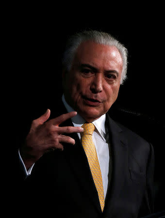Brazil's President Michel Temer gestures as he attends a Brazilian Democratic Movement party (MDB) meeting in Brasilia, Brazil May 22, 2018. REUTERS/Adriano Machado