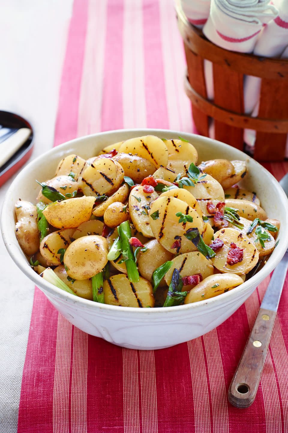 grilled potato salad with bacon vinaigrette in a serving bowl