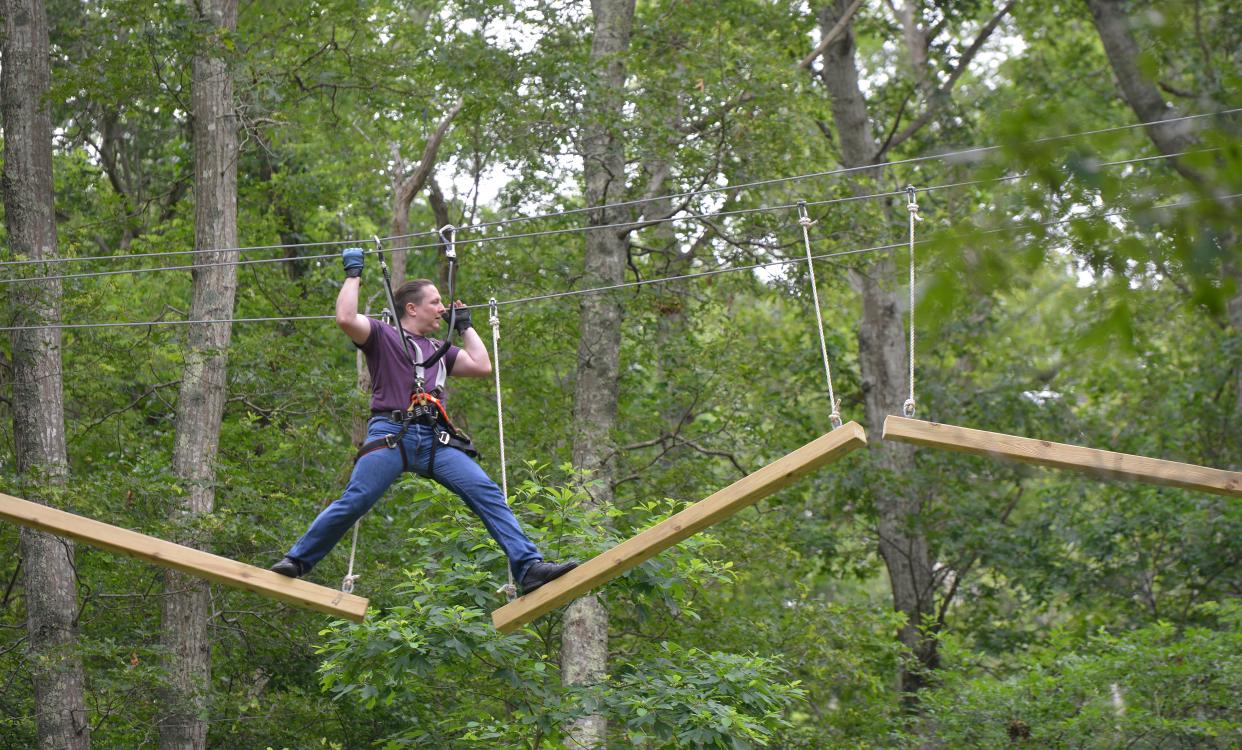 JD Fanning, of Sharon, works through one of the courses at the Adventure Park. Fanning has been to the Sandwich park several times in addition to other parks in Connecticut and New York. A ribbon cutting ceremony was held Tuesday morning at the Adventure Park at Heritage Museums & Gardens.