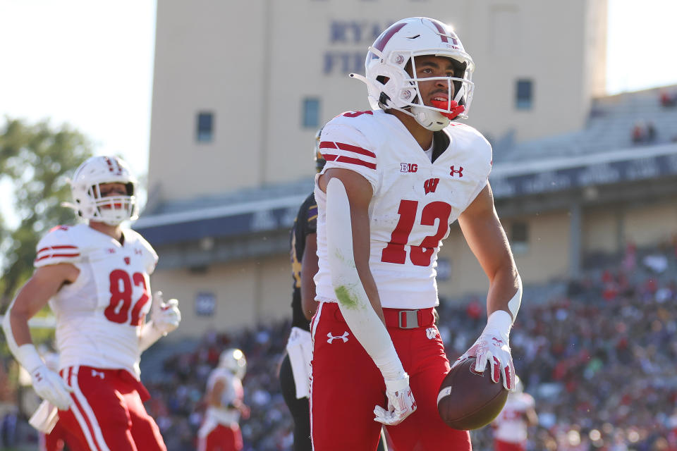 EVANSTON, ILLINOIS – OCTOBER 08: Chimere Dike #13 of the Wisconsin Badgers celebrates a first down reception against the <a class="link " href="https://sports.yahoo.com/ncaaf/teams/northwestern/" data-i13n="sec:content-canvas;subsec:anchor_text;elm:context_link" data-ylk="slk:Northwestern Wildcats;sec:content-canvas;subsec:anchor_text;elm:context_link;itc:0">Northwestern Wildcats</a> during the first half at Ryan Field on October 08, 2022 in Evanston, Illinois. (Photo by Michael Reaves/Getty Images)