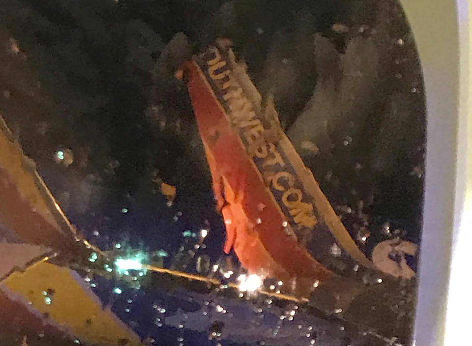 This photo taken onboard by a passenger on a Southwest Airlines flight to Atlanta appears to show the top fin of another Southwest Airlines plane clipped off after the two planes collided, Saturday, July 20, 2019, on the tarmac of Nashville International Airport, in Nashville, Tenn. The airline says both planes returned to the gate "under their own power" and were taken out of service for evaluation. The Southwest flights will continue to the scheduled destinations using news planes. (Eric Borden via AP)