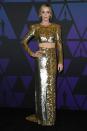 Emily Blunt shone in a shimmering gold and silver long-sleeved crop-top and skirt combo from Dundas by Peter Dundas. Hollywood, November 18, 2018