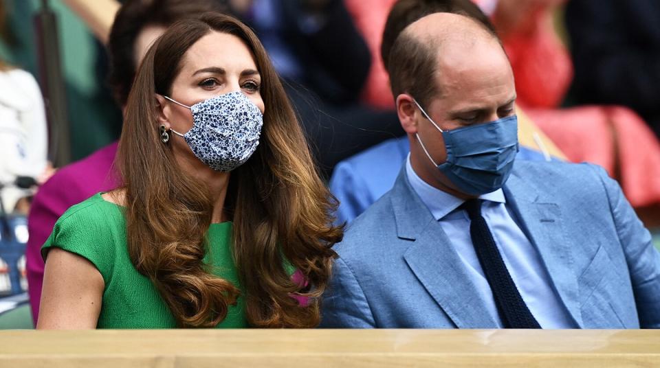 Britain's Catherine, Duchess of Cambridge and Britain's Prince William, Duke of Cambridge, wearing face masks, take their sets in the Royal box to watch the women's singles final on the twelfth day of the 2021 Wimbledon Championships at The All England Tennis Club in Wimbledon, southwest London, on July 10, 2021.