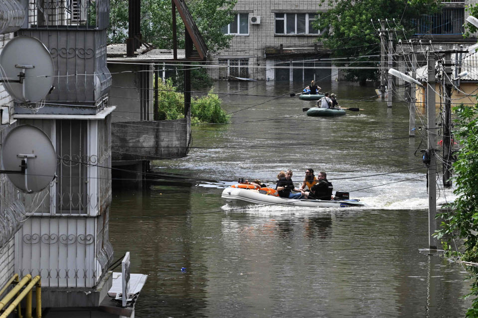 Ukraine and Russia accused each other of shelling in the flood-hit Kherson region on June 8, 2023 even as rescuers raced to save people stranded after the destruction of a Russian-held dam unleashed a torrent of water.  (Genya Savilov / AFP - Getty Images)