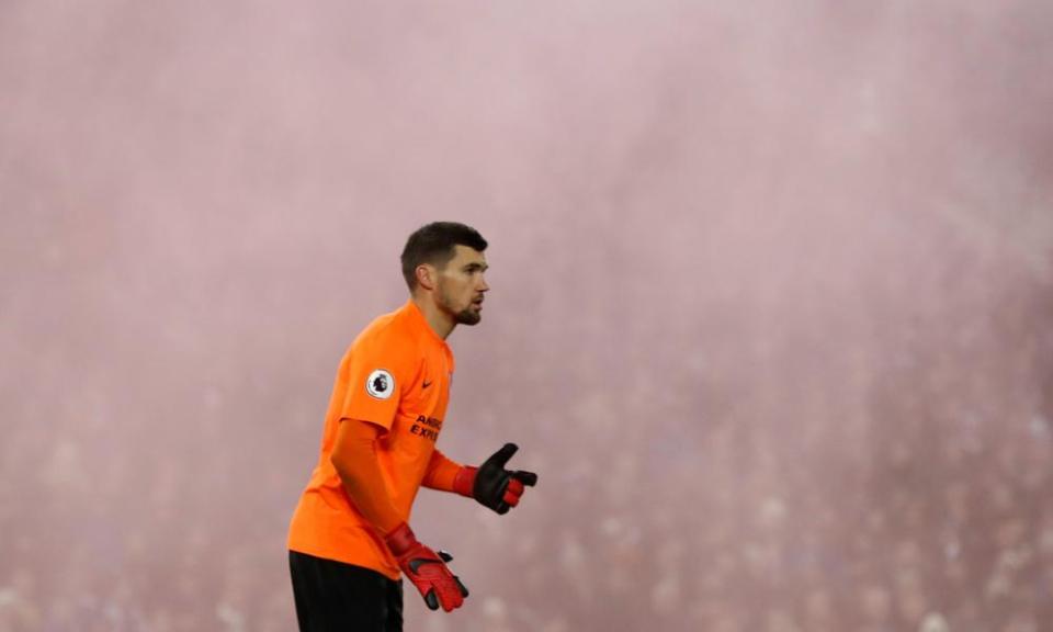 Brighton’s goalkeeper Maty Ryan surrounded by smoke from a flair at the Amex Stadium during the evening Premier League game against Crystal Palace in November.