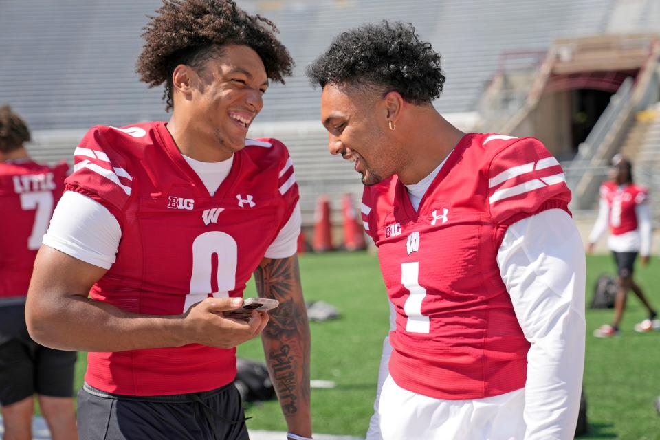 Wisconsin running backs Braelon Allen (0) and Chez Mellusi have a laugh at media day.