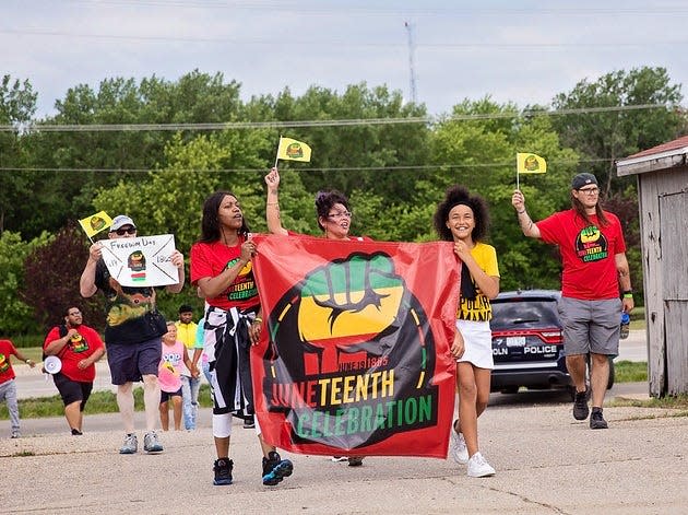 Juneteenth 2021 participants enter the fairgrounds during the walking parade from downtown Lincoln.